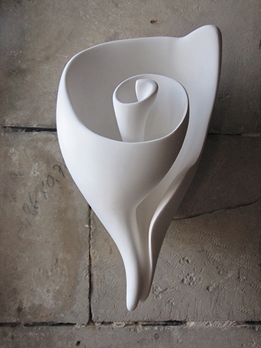 This iconic sculptural shell wall light is the signature piece by artist and lamp maker Hannah Woodhouse. The Graciela shell wall light is available as a wall light, table lamp or sculpture.