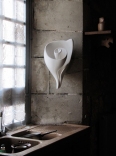 This iconic sculptural shell wall light is the signature piece by artist and lamp maker Hannah Woodhouse. The Graciela shell wall light is available as a wall light, table lamp or sculpture.