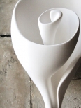 This iconic sculptural shell wall light is the signature piece by artist and lamp maker Hannah Woodhouse. The Graciela shell wall light is available as a wall light, table lamp or sculpture.